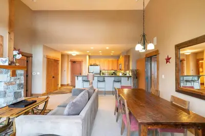 a living room with a couch and a table at Catamount Lodge 401 by East West Hospitality in Truckee