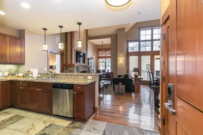 a kitchen with a sink and a stove top oven at Catamount Lodge 408 by East West Hospitality in Truckee