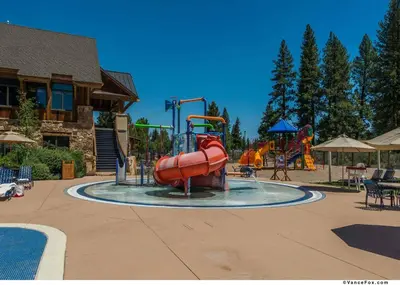a water park with a slide and a playground at Fairway Drive 13136 by East West Hospitality in Truckee