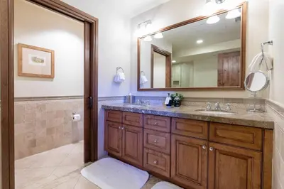 a bathroom with a sink and a mirror at Great Bear Lodge 206 by East West Hospitality in Truckee