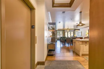 a room with a kitchen and a dining room at Great Bear Lodge 206 by East West Hospitality in Truckee