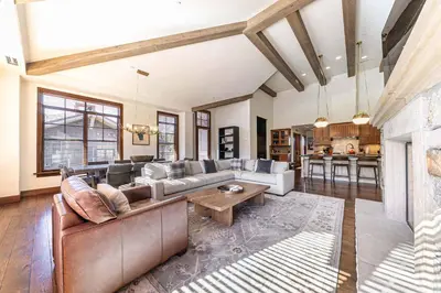 a living room with a couch and a table at Great Bear Lodge 501 by East West Hospitality in Truckee