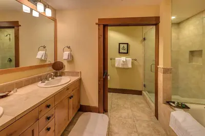 a bathroom with a sink and a shower at Iron Horse Lodge South 406 by East West Hospitality in Truckee