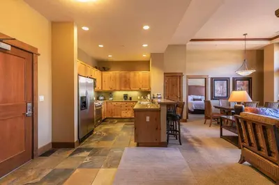 a kitchen and living room with a kitchen and a dining room at Iron Horse Lodge North 107 by East West Hospitality in Truckee