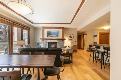 a living room with a couch and a fireplace at Iron Horse Lodge North 206 by East West Hospitality in Truckee