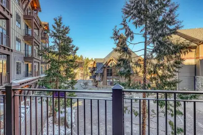 a balcony of a house with a fence at Iron Horse Lodge South 209 by East West Hospitality in Truckee