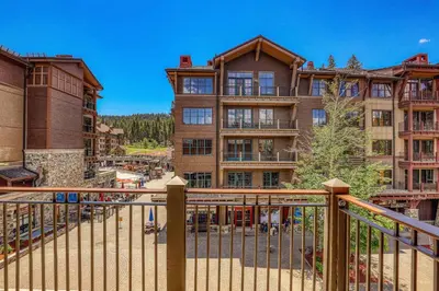 a view of a large apartment building from a balcony at Iron Horse Lodge North 302 by East West Hospitality in Truckee