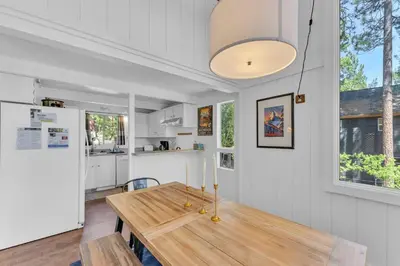 a kitchen and dining room with a wooden table at Bright 3BR Near Kings Beach and Northstar in Tahoe Vista