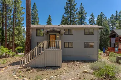 a large white house with a tree at Bright 3BR Near Kings Beach and Northstar in Tahoe Vista