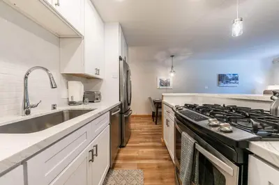 a kitchen with a stove and a sink at Ski Trails 4115 by East West Hospitality in Truckee