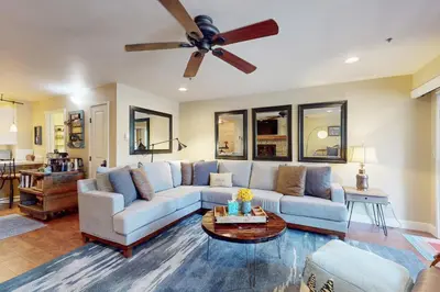 a living room with a couch and a ceiling fan at Knotty & Nice in Incline Village