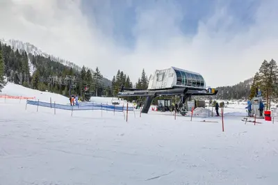 a ski resort with a building in the snow at Ski-InandSki-Out and Resort Perks Olympic Valley Gem in Olympic Valley