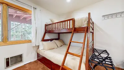 a room with two bunk beds and a window at Lakeview Villas #24 condo in Mammoth Lakes