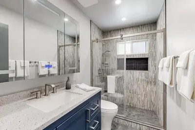 a bathroom with a sink and a toilet and a shower at Modern Mountain Retreat in Incline Village