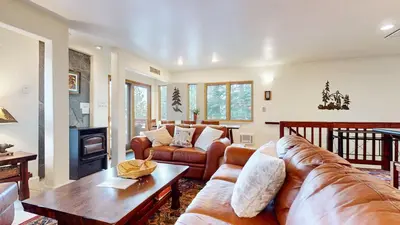 a living room with a couch and a table at Lakeview Villas #26 condo in Mammoth Lakes