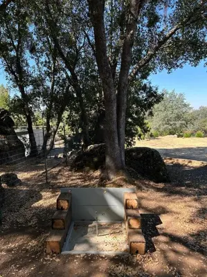 a white box sitting under a tree in a field at Private Country Home Near Downtown - Sonora in Sonora