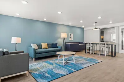 a living room with a couch and a table at WoodSpring Suites Ceres - Modesto in Ceres