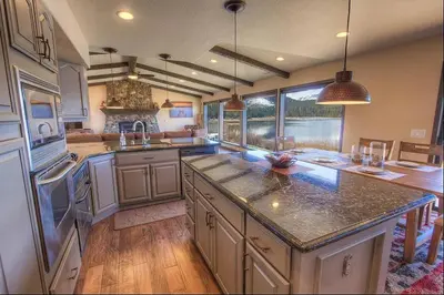 a large kitchen with a large island in the middle at Epiphany home in South Lake Tahoe