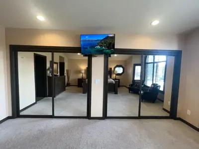 a living room with a tv on top of a mirror at Epiphany home in South Lake Tahoe