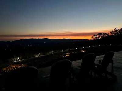 a group of people sitting at a table watching the sunset at Enchanted Property near Yosemite, View, Game Room in Ahwahnee