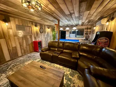 a living room with a leather couch and a table at Enchanted Property near Yosemite, View, Game Room in Ahwahnee