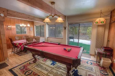 a living room with a pool table in it at Bambi's Bunkhouse home in South Lake Tahoe