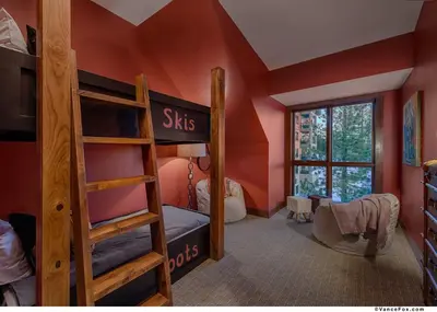 a bedroom with a bunk bed and a ladder at Penthouse Residence The Ritz-Carlton Lake Tahoe in Truckee