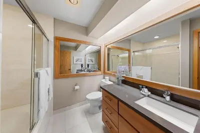 a bathroom with a sink and a toilet and a shower at Palisades Tahoe Lodge Rentals Studio Loft #356 in Olympic Valley