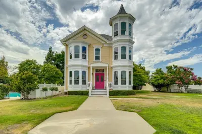 a large house with a pink door at Modesto Mansion on 2 Acres - Great for Families! in Modesto