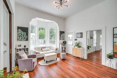 an open living room with a couch and chairs at Modesto Mansion on 2 Acres - Great for Families! in Modesto