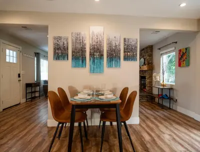 a dining room with a table and chairs at Truckee River Ranch in Reno