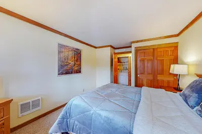 a bedroom with a bed and a picture on the wall at Mountainback 35 in Mammoth Lakes