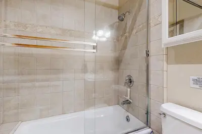 a bathroom with a tub and a glass shower at Spacious Deck with Private Hot Tub Kings Beach Gem in Wood Vista