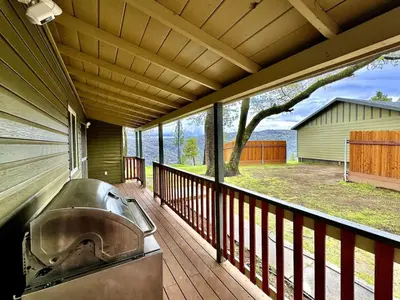 a balcony with a grill and a view of a yard at Foothill Wine Country Gem in Somerset