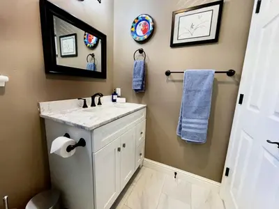 a bathroom with a sink and a mirror at Foothill Wine Country Gem in Somerset