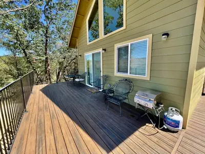 a deck with chairs and a grill on a house at Foothill Wine Country Gem in Somerset