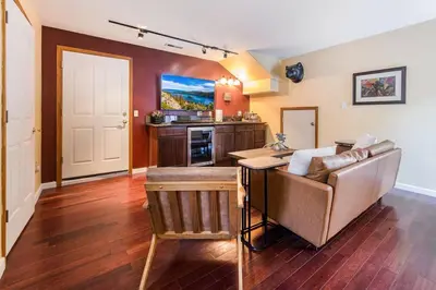 a living room with a couch and a table at Alpine Cottage Hideaway in Stateline