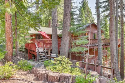a tree house in the woods with a deck at 1 Mi to Beach Peaceful Tahoe Vista Home with Decks! in Tahoe Vista