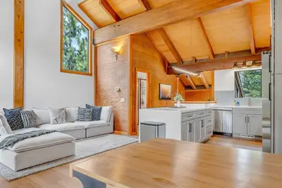 a living room with a couch and a table at Bright 3BR Condo Near Northstar in Truckee