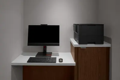 a desk with a computer monitor and a printer at Courtyard by Marriott Reno Sparks in Clark