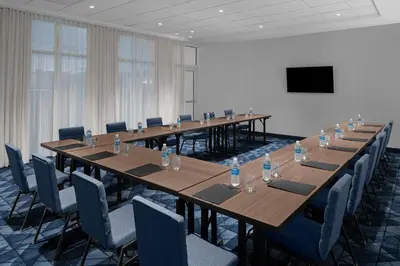 a large conference room with long tables and chairs at Courtyard by Marriott Reno Sparks in Clark