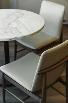 two chairs and a table and a table and a chair at Chicken Ranch Casino Resort in Jamestown