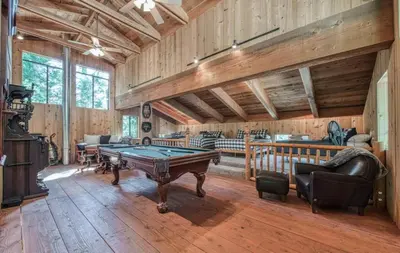 a living room with a pool table in it at Waterfall Lodge Yellowstone Vibes AC Space in Shaver Lake