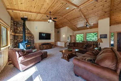 a large living room with couches and a fireplace at The Restful Rose Fireside Vibes AC Comfort in Shaver Lake
