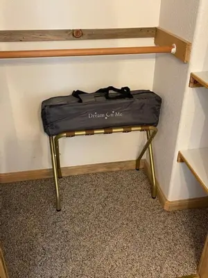 a suitcase sitting on a stool in a room at The Knotty Sparrow Prime Spot Smores Nights in Shaver Lake