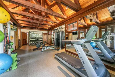 a gym with several treadmills and exercise bikes at Chambers Lakeside Escape w Lake Views & HOA Access! in Homewood