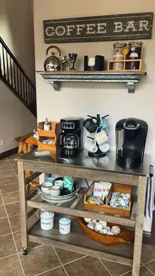 a coffee shop cart with a coffee bar sign on the wall at The Chalet at Shaver Lake We Have it ALL! in Shaver Lake
