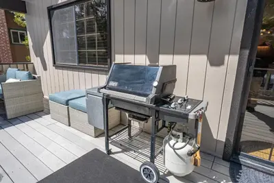 a grill with a laptop on top of it on a porch at Ridgeview Retreat Location Meets Comfort AC! in Shaver Lake