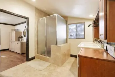 a large bathroom with a shower and a sink at Hibernation Station Walkable, Warm Well-Loved in Shaver Lake
