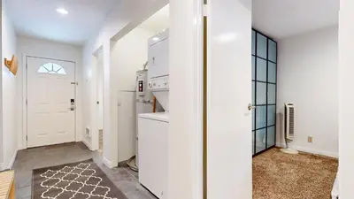 a white kitchen with a stove and a refrigerator at Lakeview Villas #09 condo in Mammoth Lakes